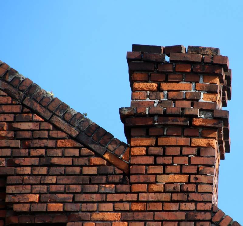 Signs Your Columbus Home Needs a Chimney Inspection Damaged chimney on an Columbus home showing cracks and missing mortar